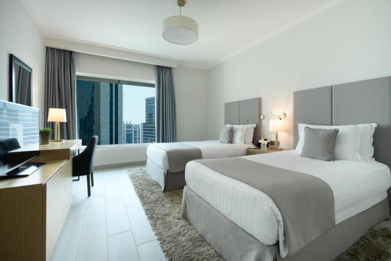 Centara West Bay Hotel & Residences Ντόχα Εξωτερικό φωτογραφία A guest room at the hotel